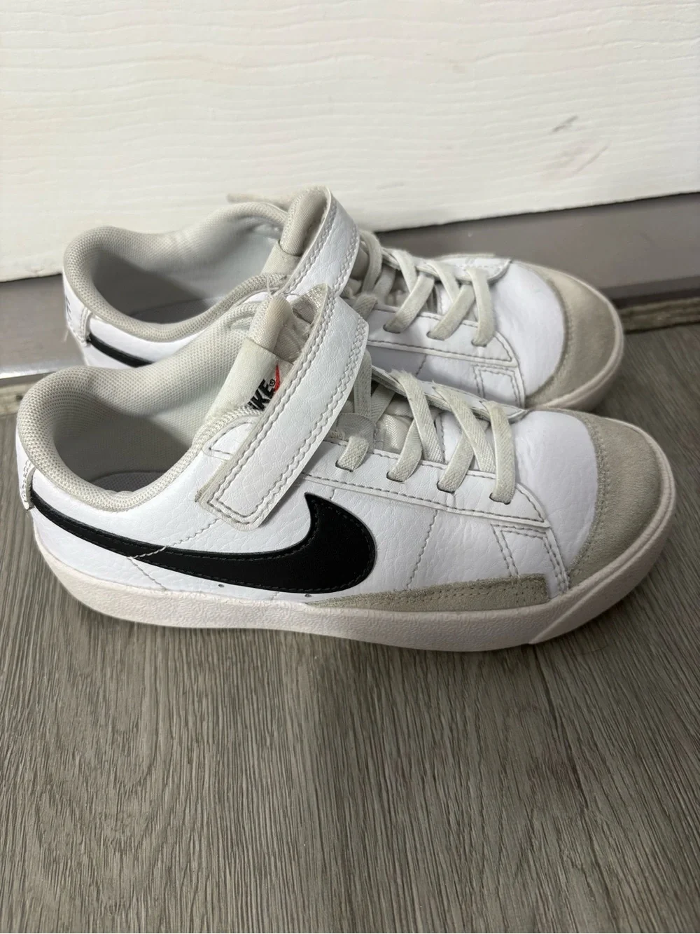 Nike Kids White Sneakers with Black Swoosh